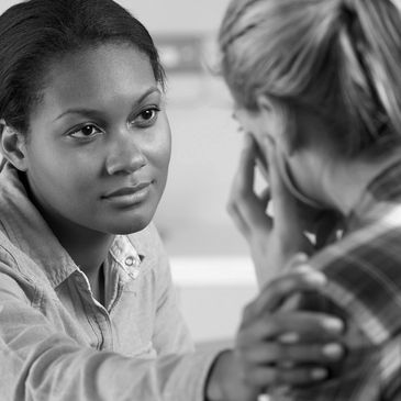Behavioral health provider and counseling patient receiving mental care.